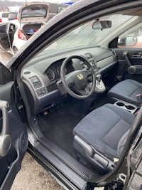 the inside of a car with a dashboard and steering wheel